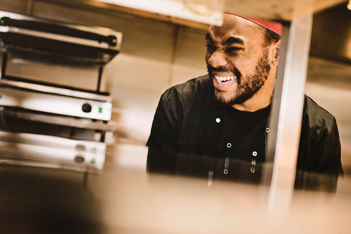 Our chef here is laughing, and captured just after placing a finished order out.